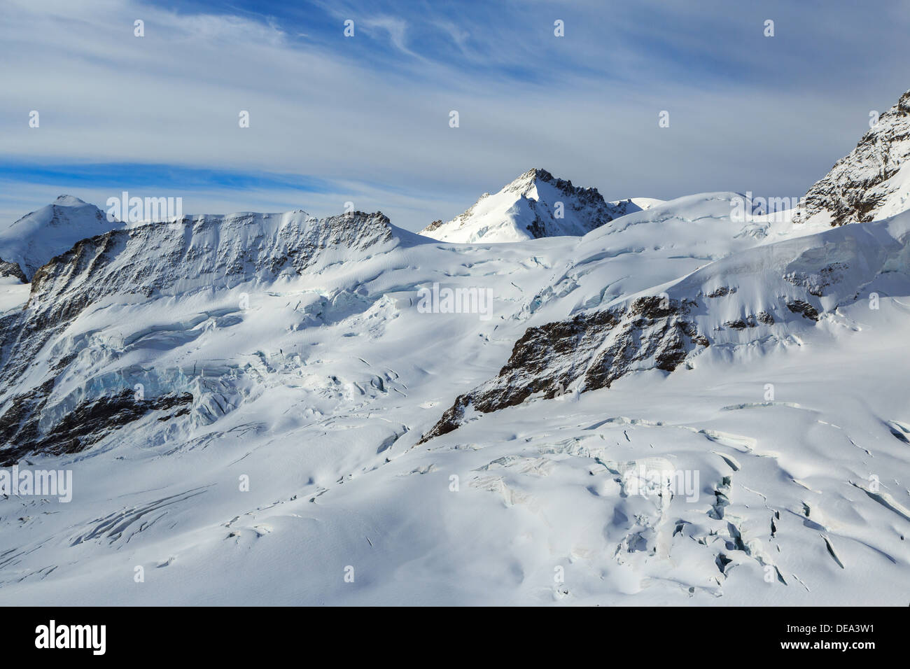 A photograph of some snow capped mountain peaks in the Jungfrau region of Switzerland. It was taken from Junfraujoch at 3500 m Stock Photo