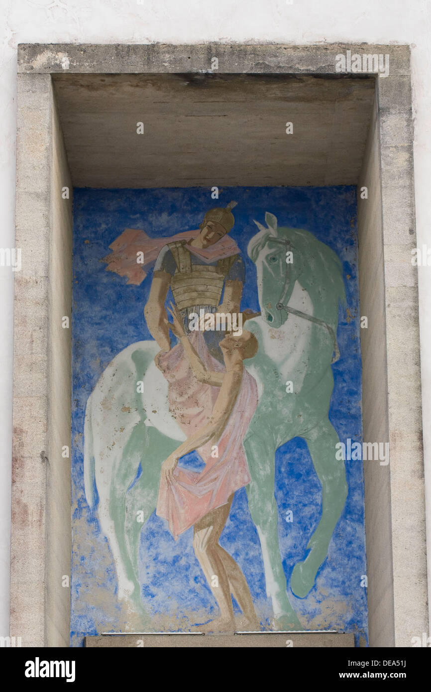 Painting above the door of the new church in the village of Oradour-sur-Glane, France. Stock Photo