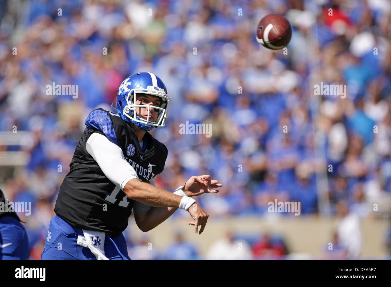 UK quarterback Maxwell Smith throws to one of his receivers in the