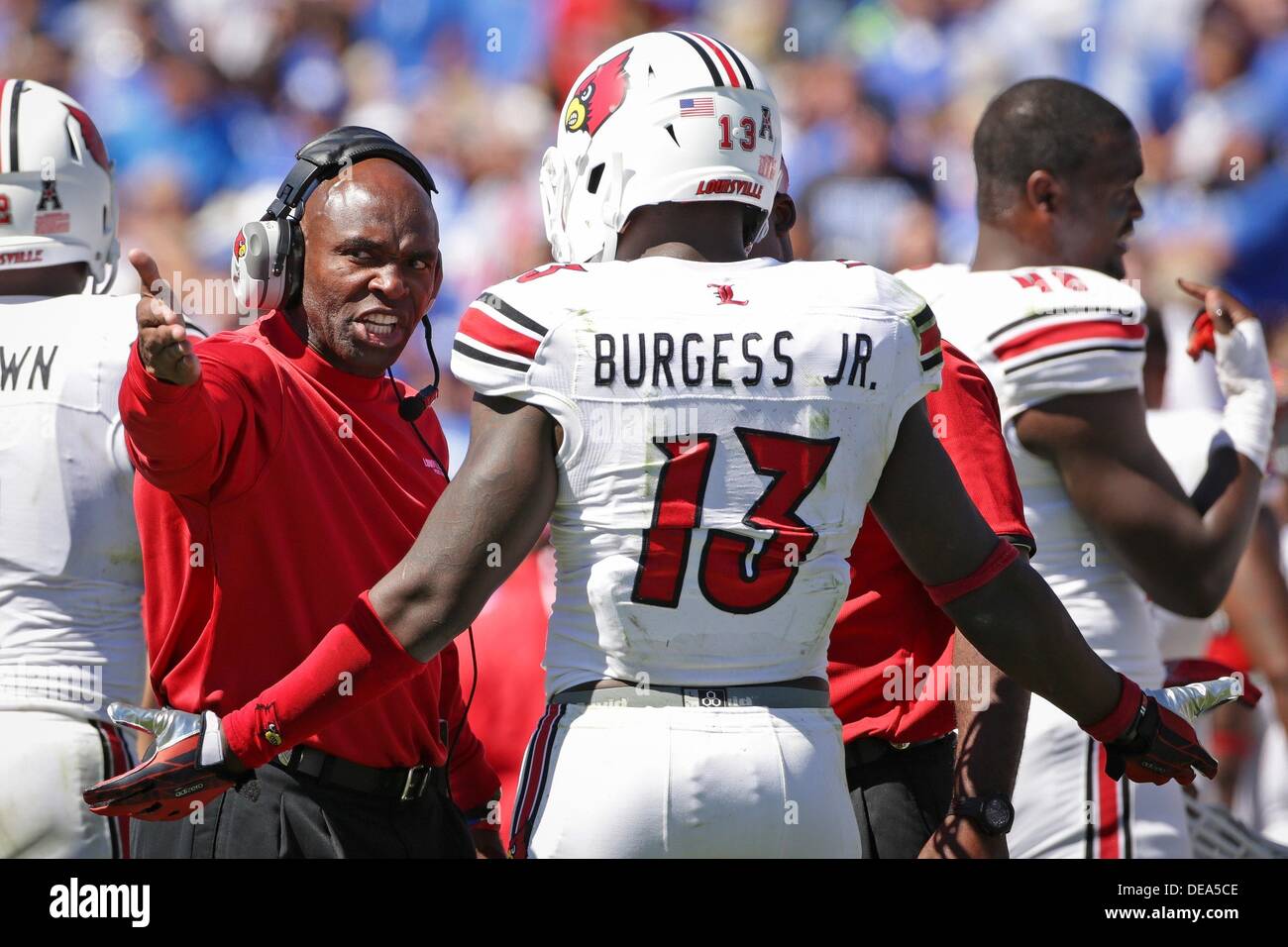 After UK almost scored, U of L head coach Charlie Strong talks over the play with UofL linebacker James Burgess in the third quarter as the University of Kentucky plays the University After UK almost scored, U of L head coach Charlie Strong talks over the play with UofL linebacker James Burgess in the third quarter as the University of Kentucky plays the University