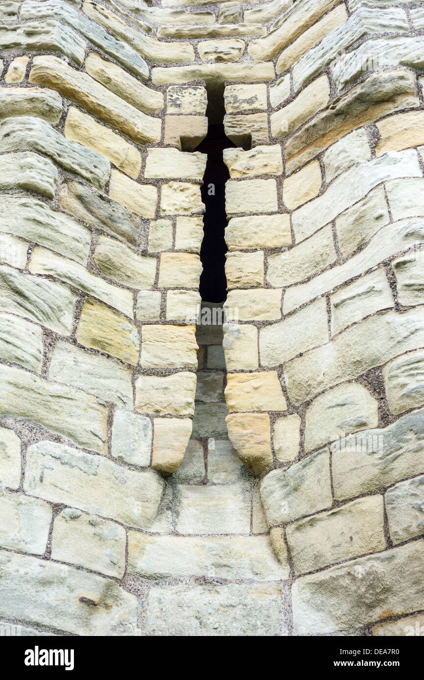 detail from Warkworth castle, Home of the Percy family c1200 Arrow slit Stock Photo