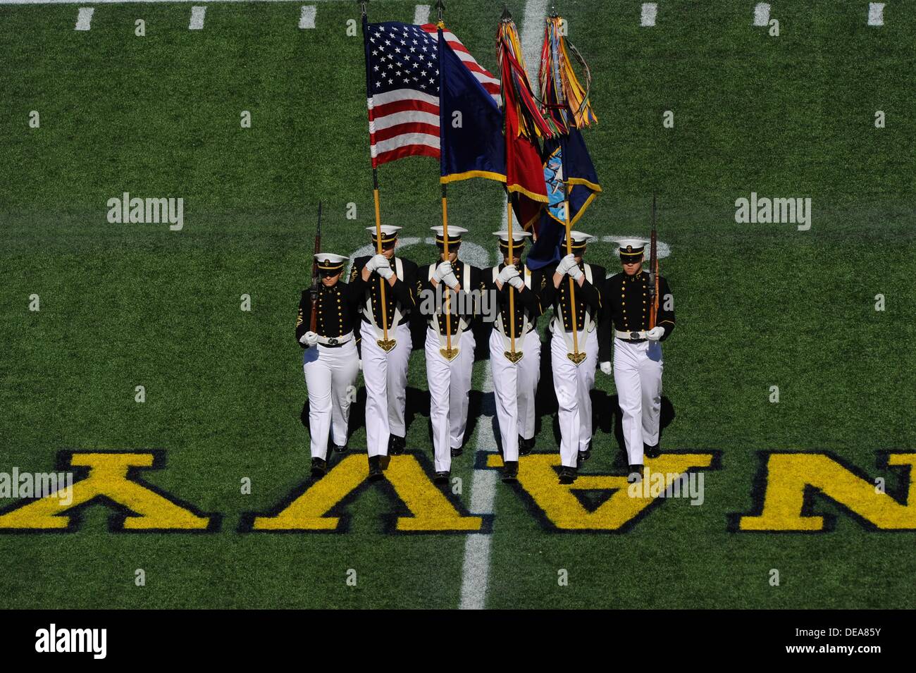 SEP 14, 2013 : The Navy Color Guard marches onto the field before the match up between the Delaware Fightin Blue Hens and the Navy Midshipmen at the Navy-Marine Corps Memorial Stadium in Annapolis, MD. Stock Photo