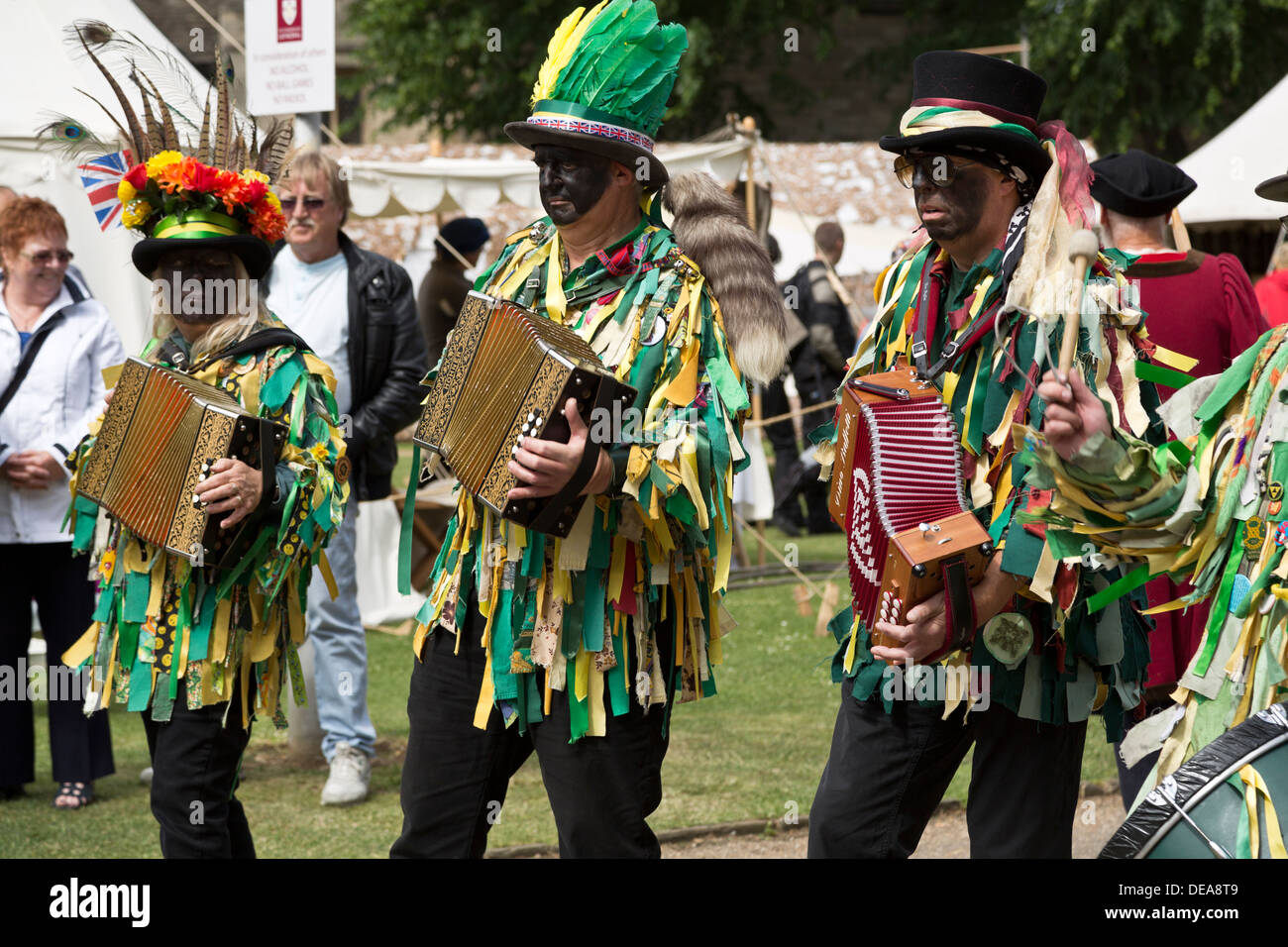 Morris dancers with black painted faces playing Dino Baffetti accordions, Peterborough Heritage Festival 22 June 2013, England Stock Photo