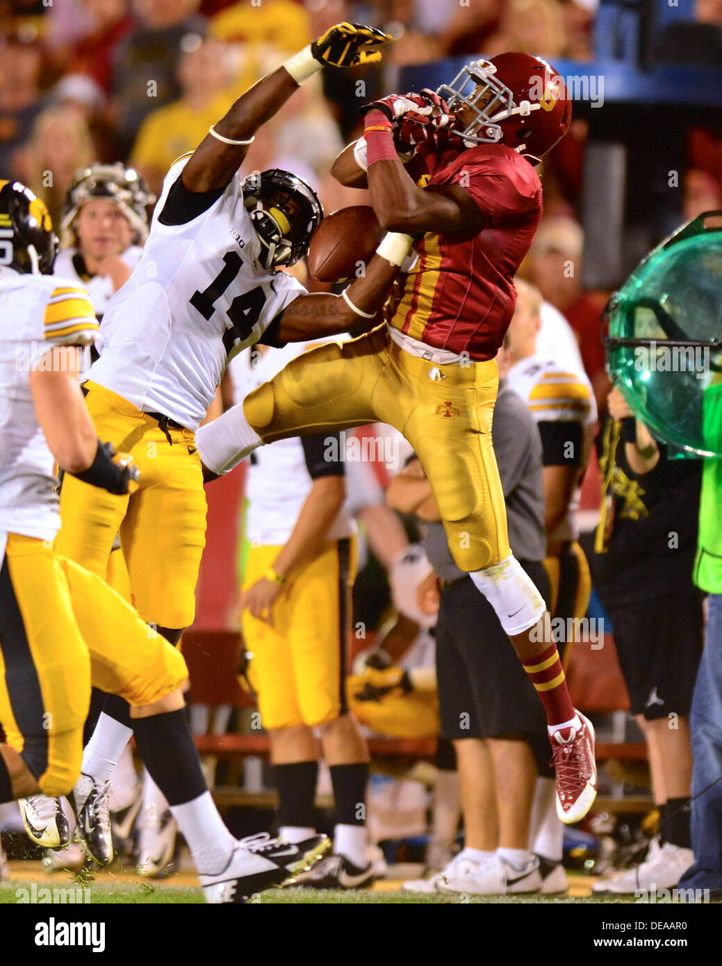 Sept. 14, 2013 - Ames, Iowa, United States of America - August 31st., 2013: Iowa DB #14 Desmond King breaking up a play on Iowa State WR #6 Tad Ecby during the NCAA football game between the Iowa State Cyclones and the Iowa Hawkeyes at Jack Trice Stadium in Ames, Iowa..Ke Lu/CSM Stock Photo
