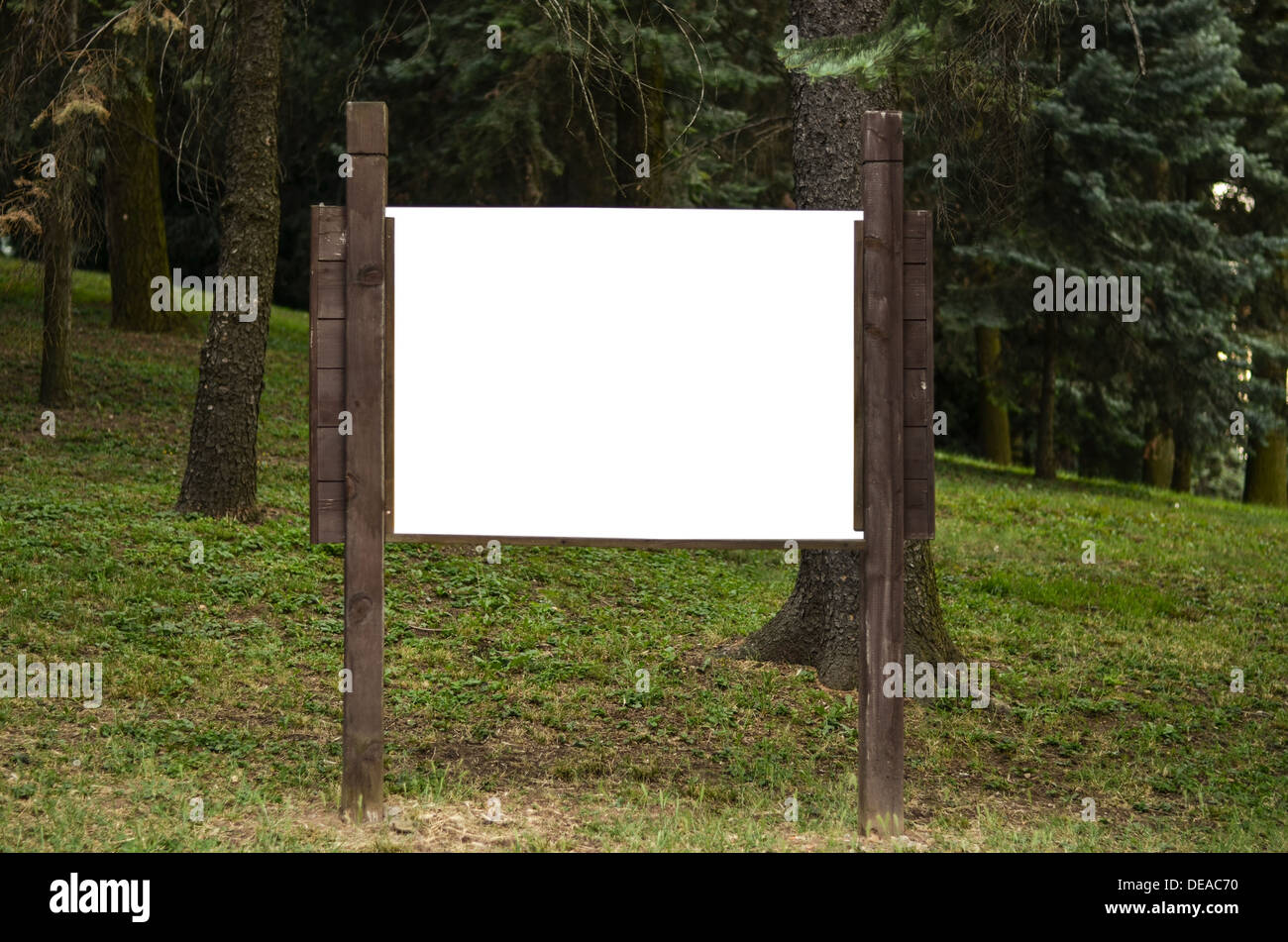 Blank wooden billboard in park Stock Photo - Alamy