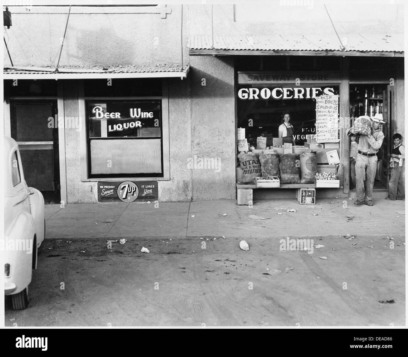 Eloy, Pinal County, Arizona. Main street of Eloy. Cotton picker comes