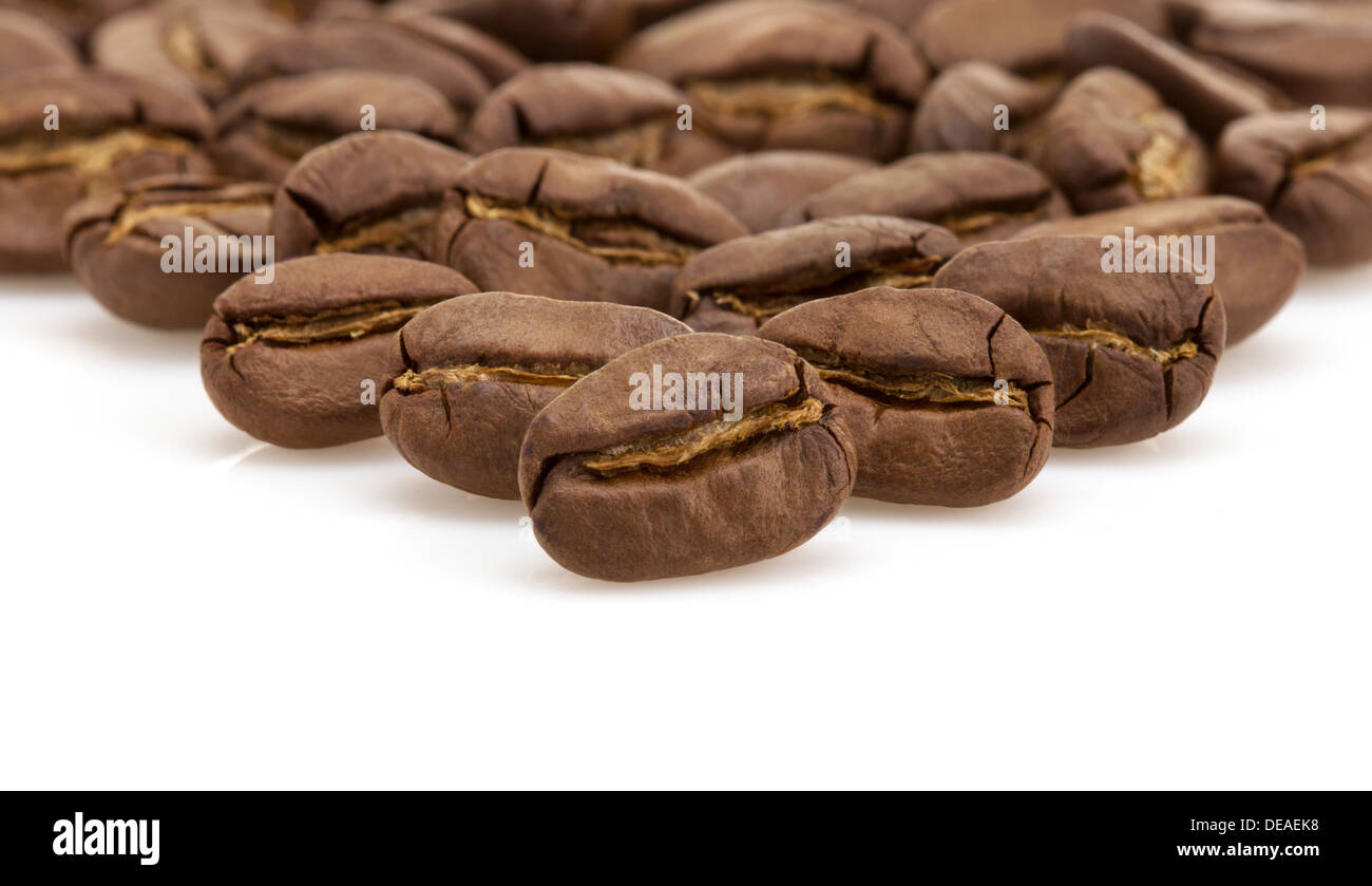 coffee beans macro isolated on white background Stock Photo - Alamy