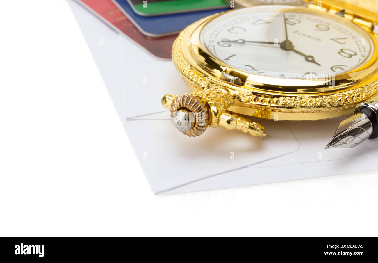 watch and pen at envelope isolated on white background Stock Photo