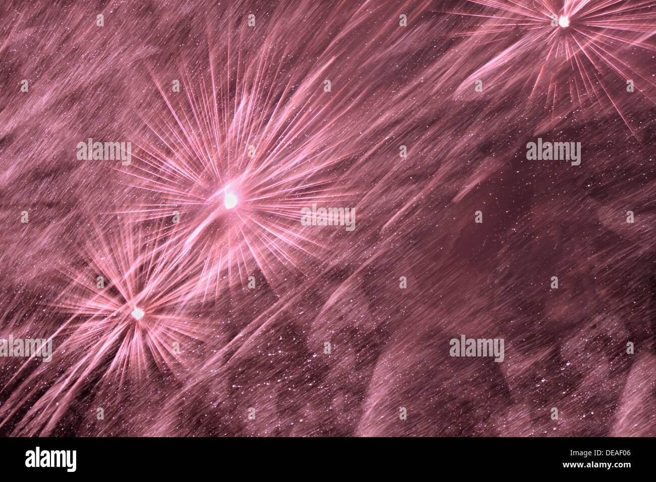 violet fireworks in night sky Stock Photo