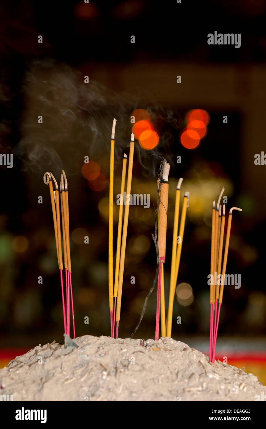 Lit incense sticks, Wat Phnom Temple, Phnom Penh, Cambodia, Southeast Asia Stock Photo