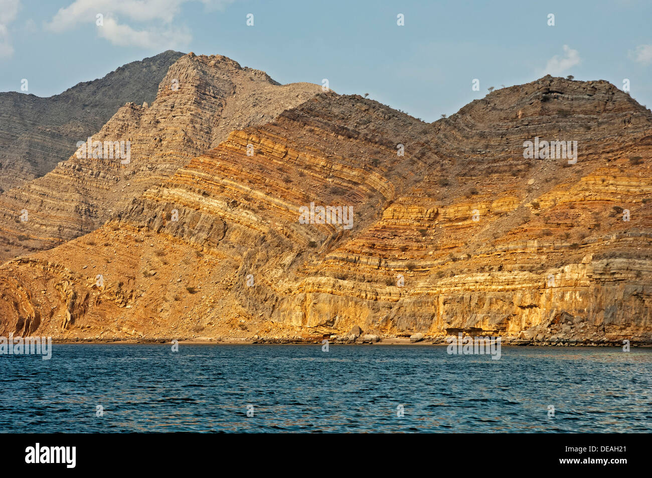 Folded rocks as a result of geological processes, rock faces of the Khor Ash Sham Fjord, Musandam Governorate, Oman Stock Photo
