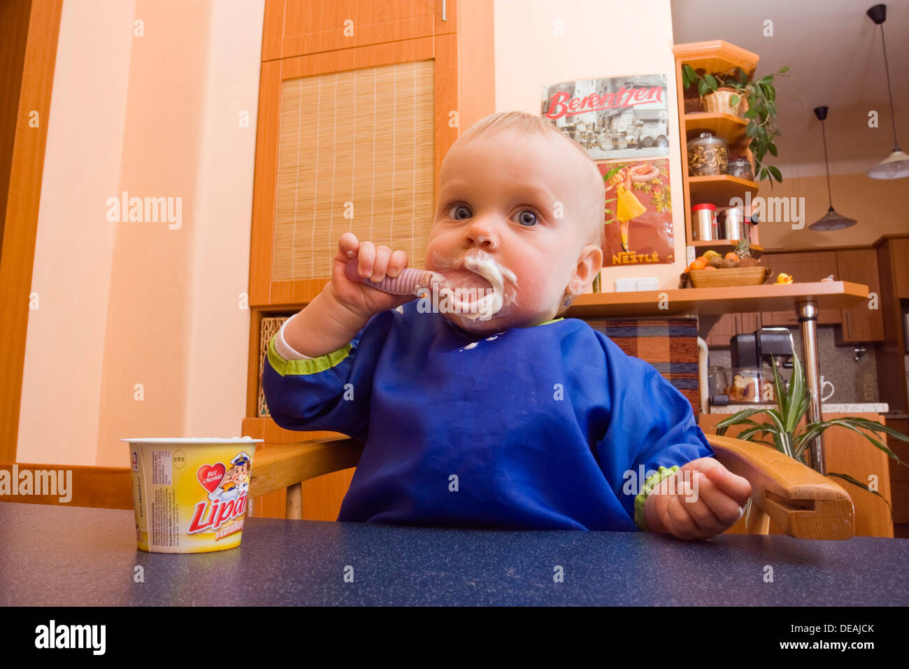 Baby, 1 year, eating Stock Photo