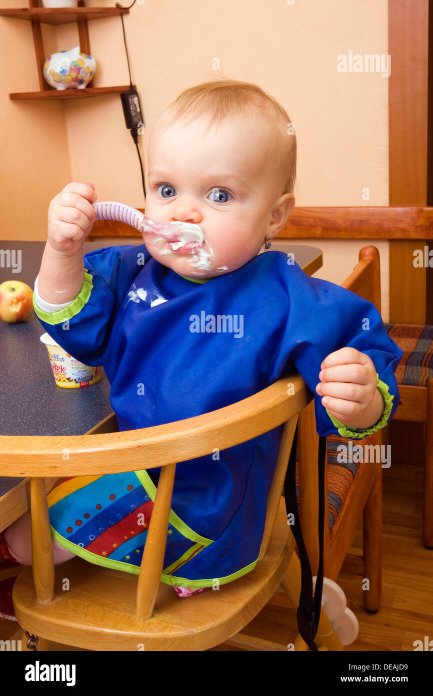 Baby, 1 year, eating Stock Photo