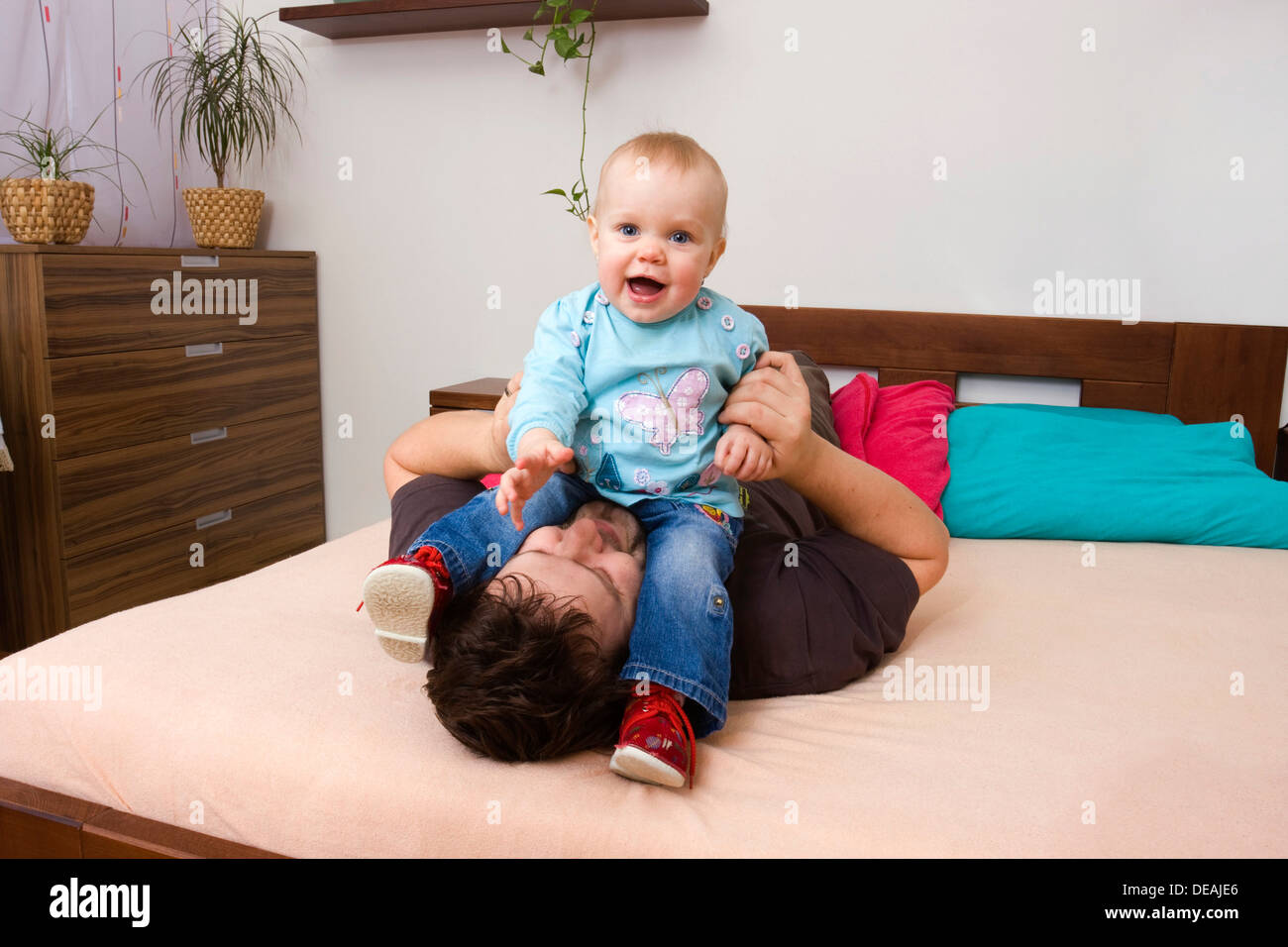 Father, 32 years, playing with baby, 1 year Stock Photo
