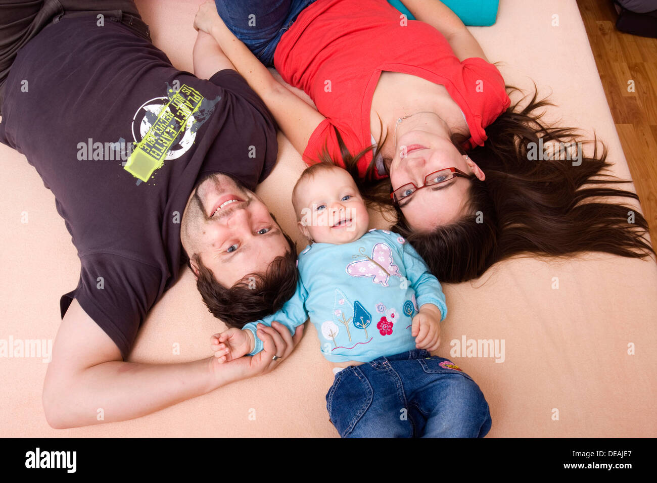 Family, mother, 28 years, father, 32 years, and baby, 1 year Stock Photo
