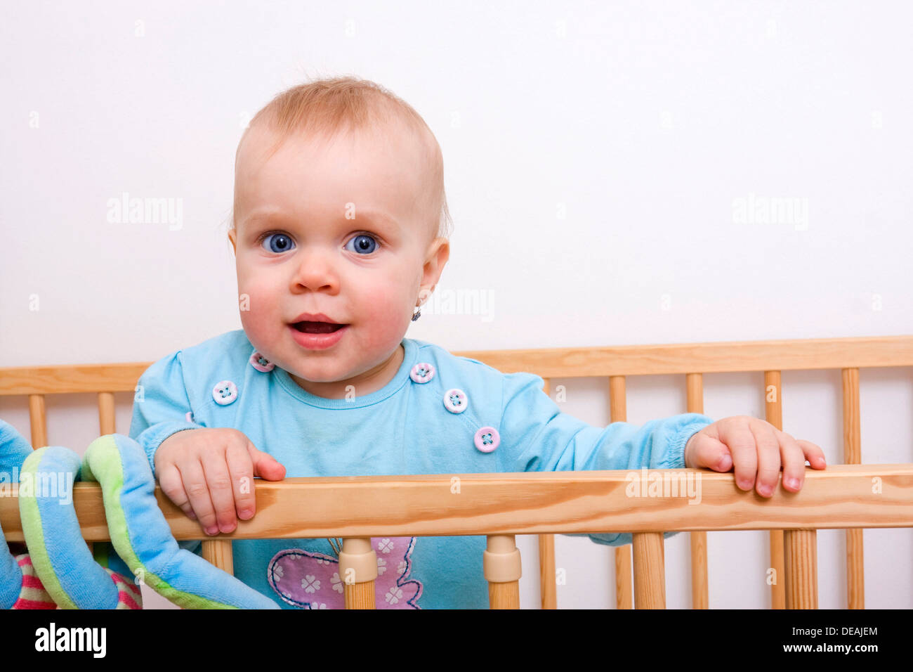 Baby, 1 year, in a cot Stock Photo Alamy