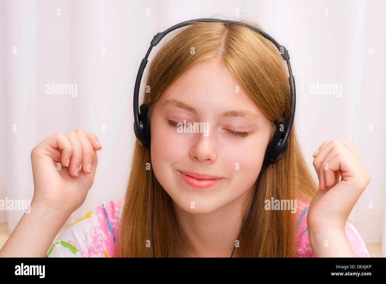 Girl, 17 years, with headphones Stock Photo