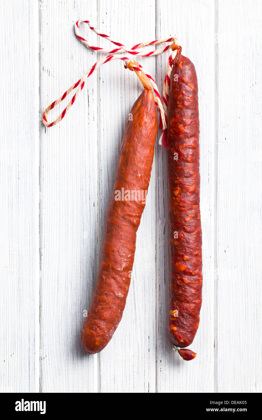 tasty chorizo sausage on kitchen table Stock Photo - Alamy