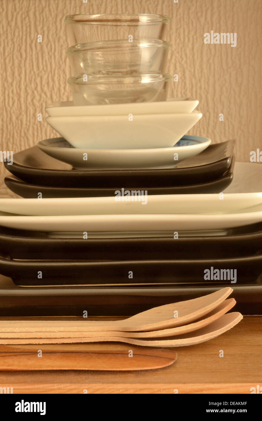 stacked dishes on shelf Stock Photo