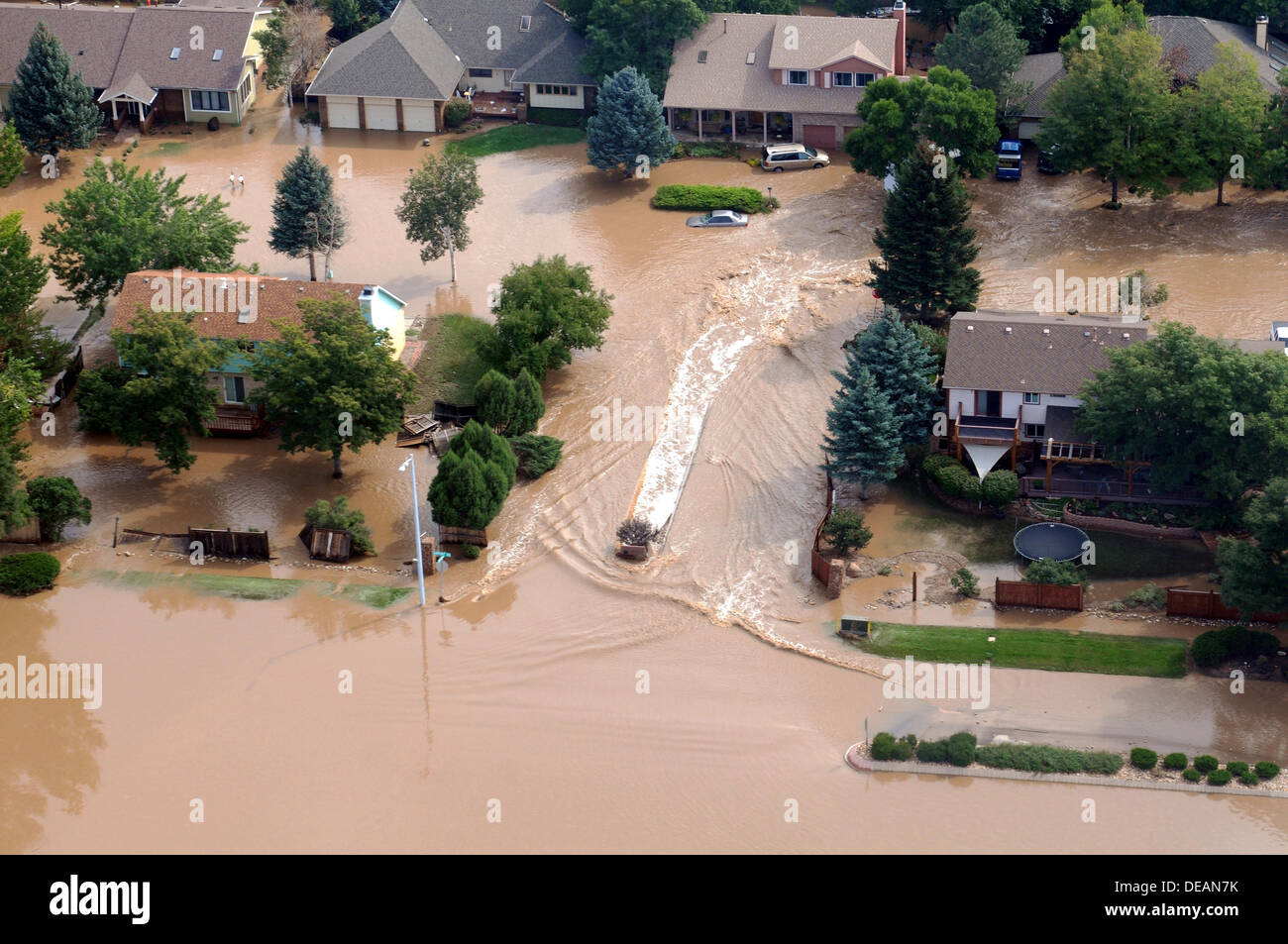 Aerial view of roads washed out and neighborhoods under water following