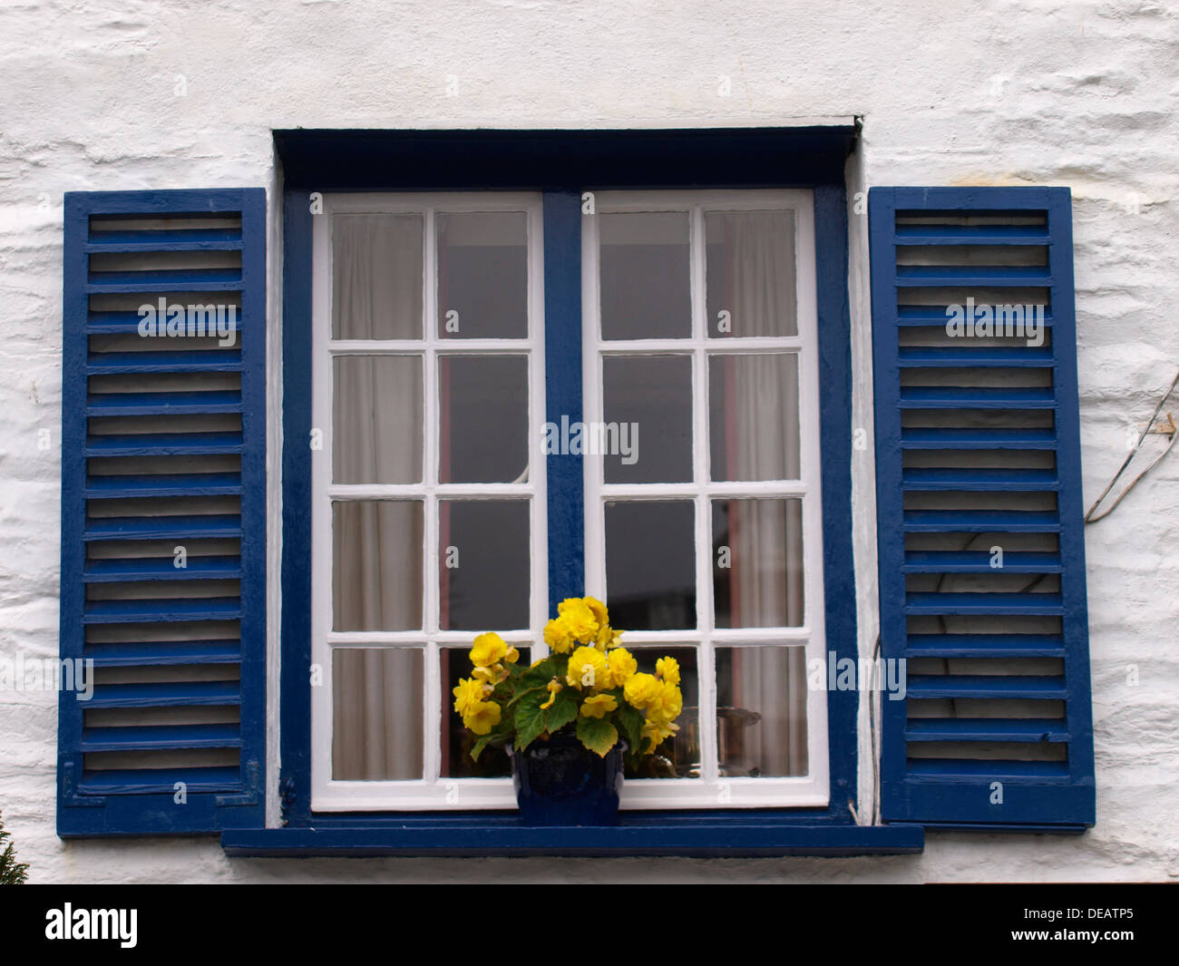 House window with decorative shutters, Looe, Cornwall, UK 2013 Stock Photo