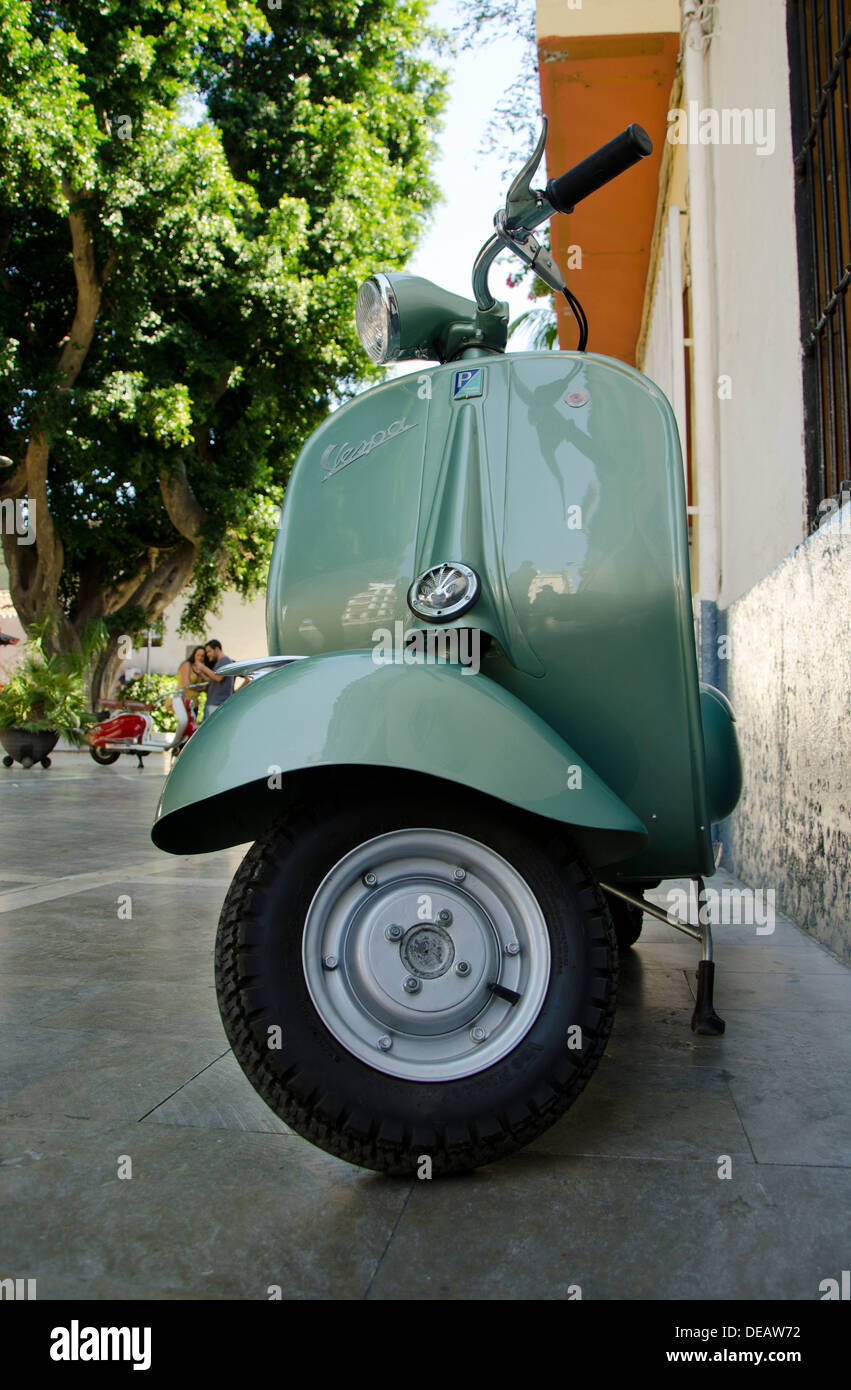 Front part of Vespa Piaggio 150 classic scooter 1962 parked in a street in Spain Stock Photo
