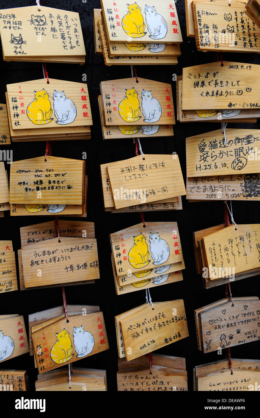 Wooden tablets with loving messages written Japanese to their departed pet cats at a cat shrine in Kagoshima, Japan. Stock Photo