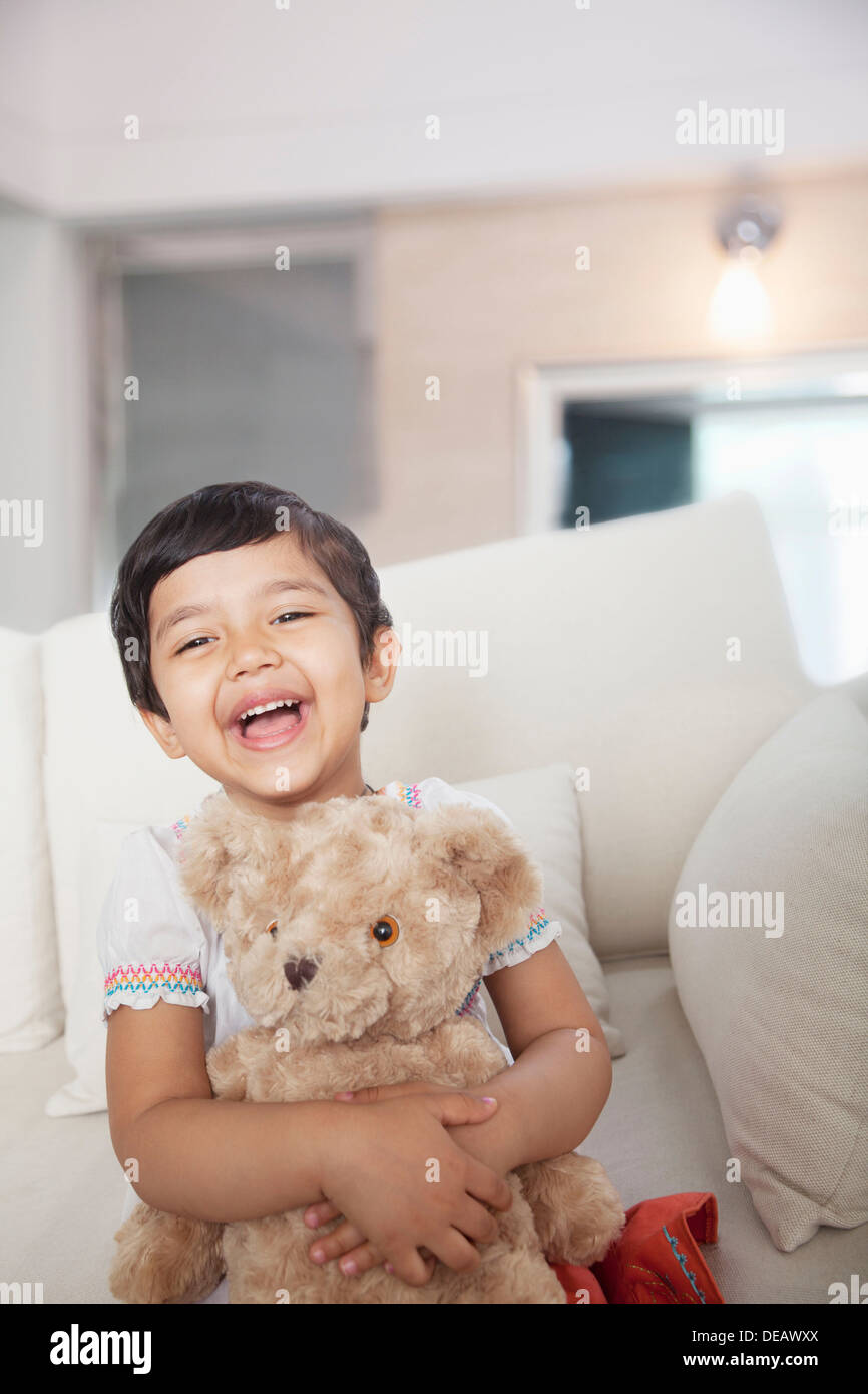 Girl holding a teddy bear hi-res stock photography and images - Alamy