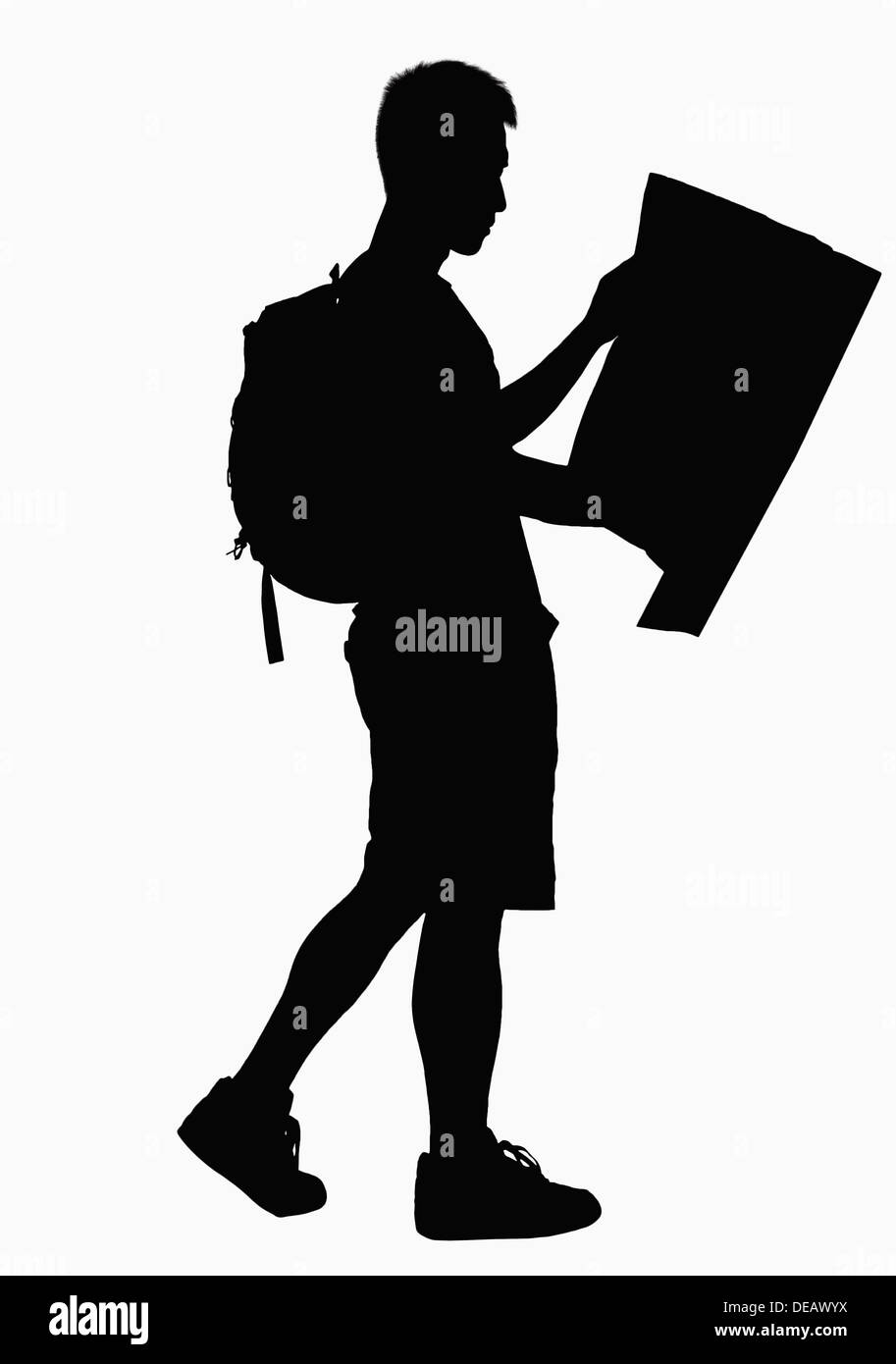 Silhouette of man looking at map. Stock Photo