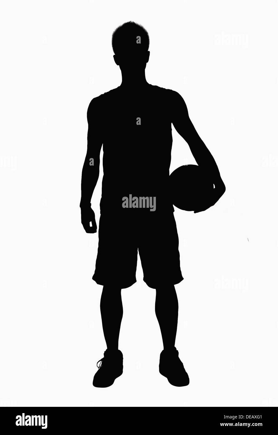 Silhouette of basketball player holding ball Stock Photo Alamy