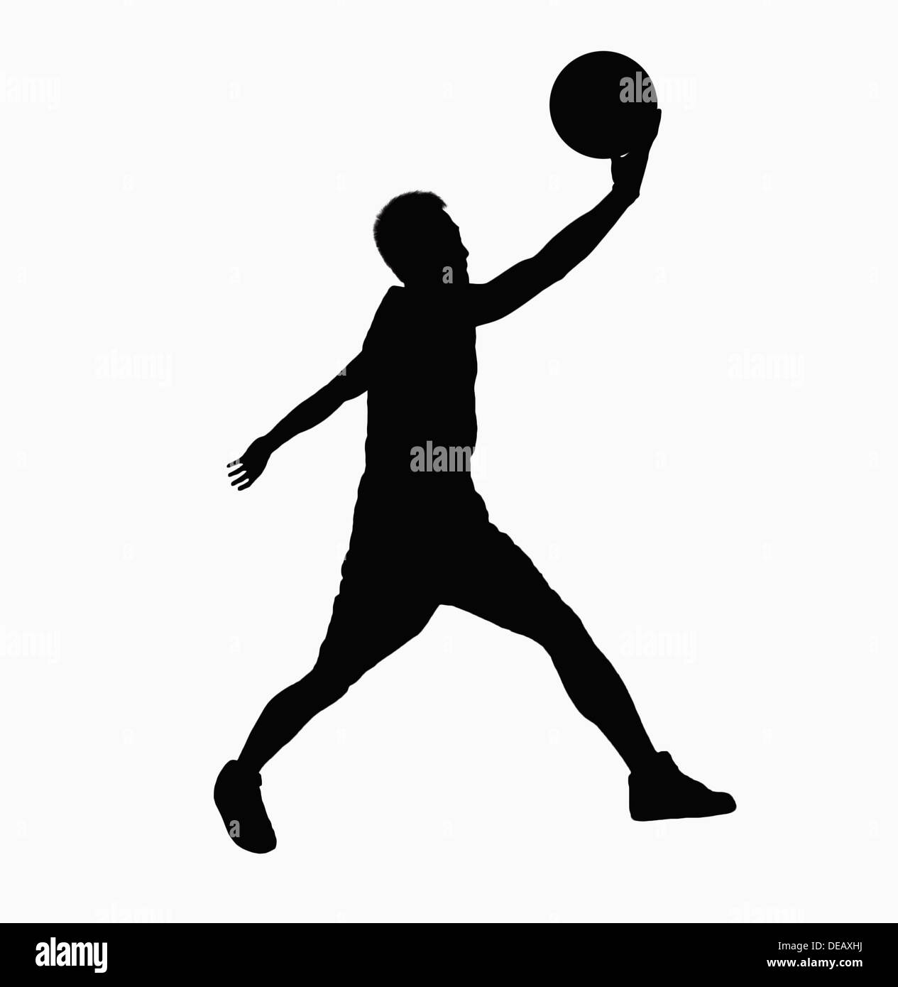 Silhouette of basketball player jumping with ball Stockfoto ...