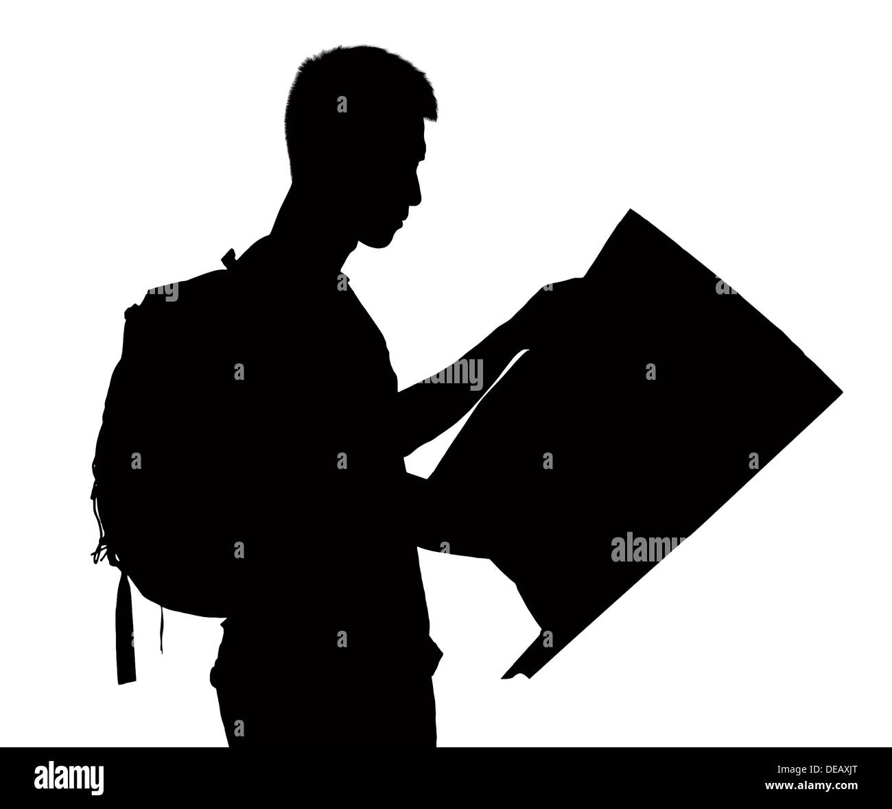 Silhouette of man looking at map. Stock Photo