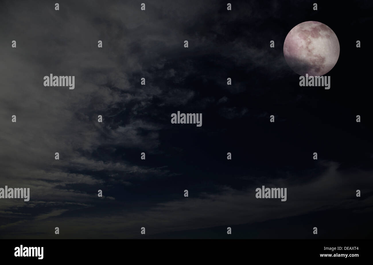 Full moon in night sky with clouds Stock Photo - Alamy
