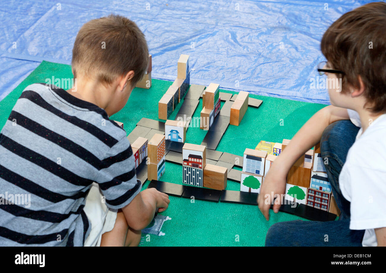 Raleigh, North Carolina, USA, September 14th 2013: Two boys playing with building blocks at the SPARKcon art festival in downtown Raleigh. Stock Photo