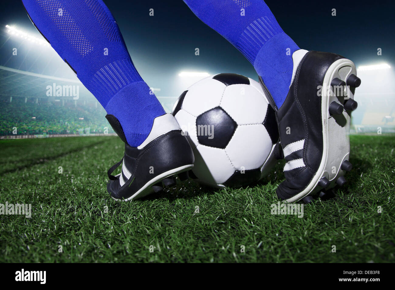 Close up of feet kicking the soccer ball, night time in the stadium Stock  Photo - Alamy