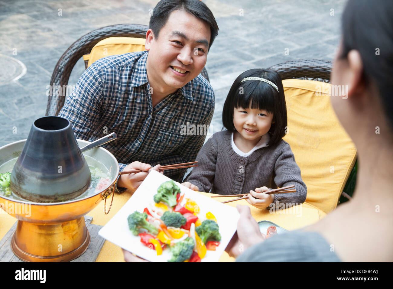 Family sharing and eating Chinese food outside Stock Photo Alamy