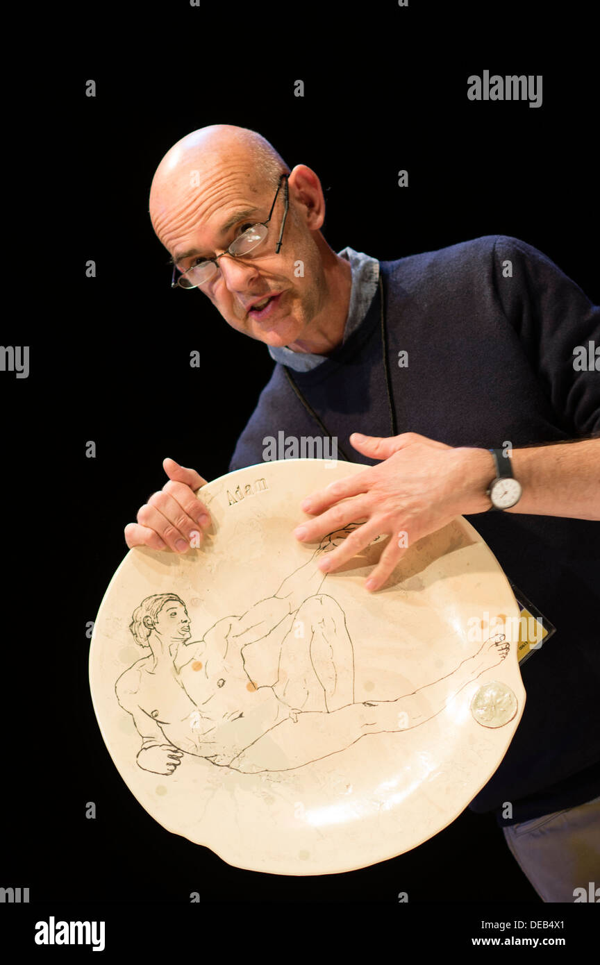 Ceramic artist STEVE DIXON demonstrating his designs on plates at the