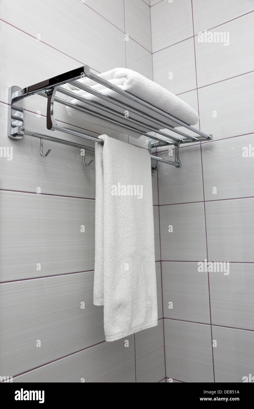 clean white towels on the rack Stock Photo Alamy