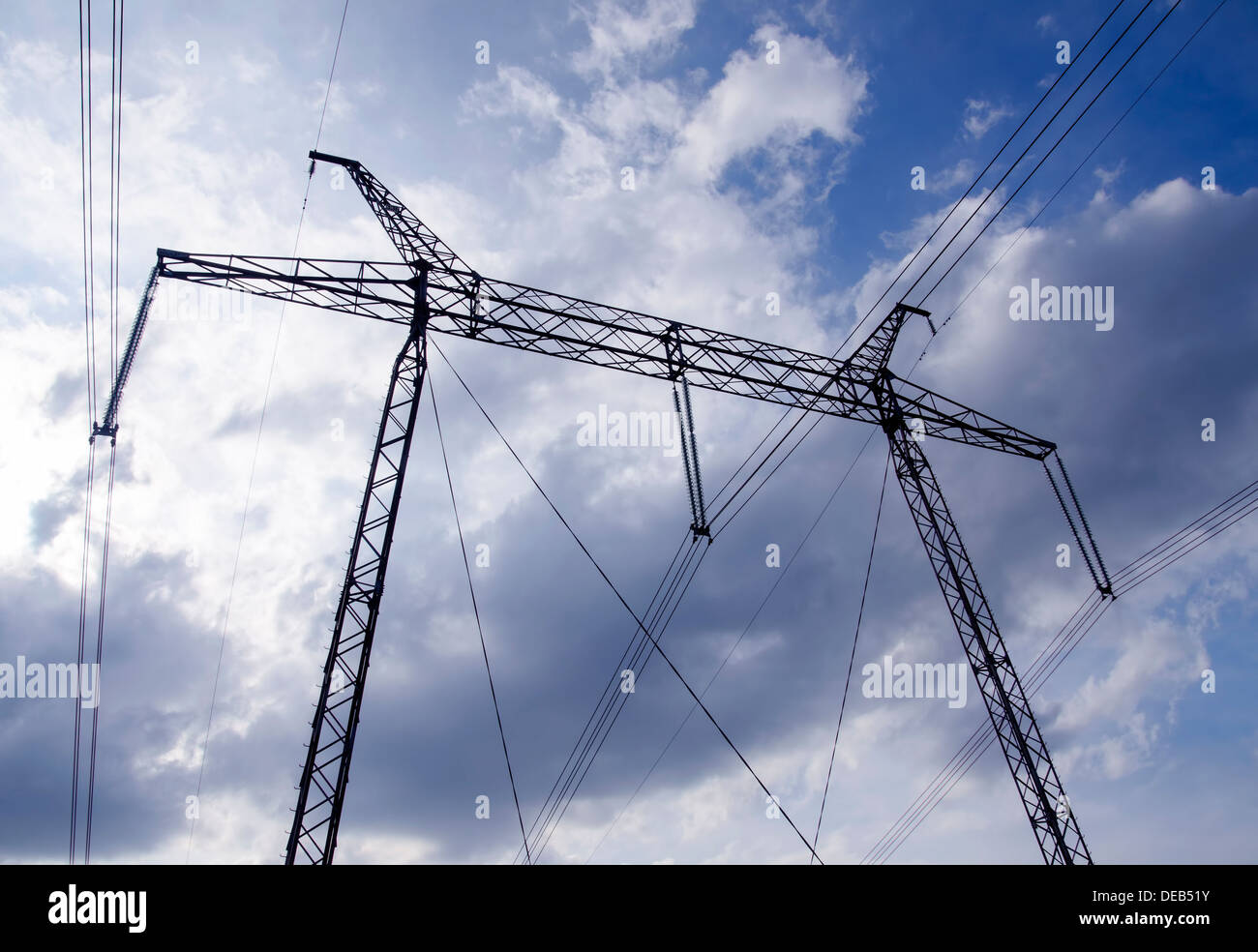 The tower of high voltage line on the blue cloudless sky background ...