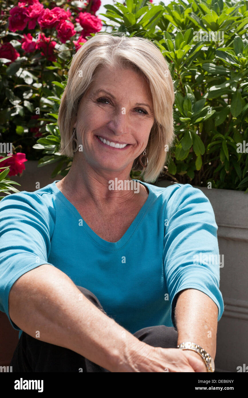 Attractive 60's Blond Woman Smiling at Camera, USA Stock Photo - Alamy