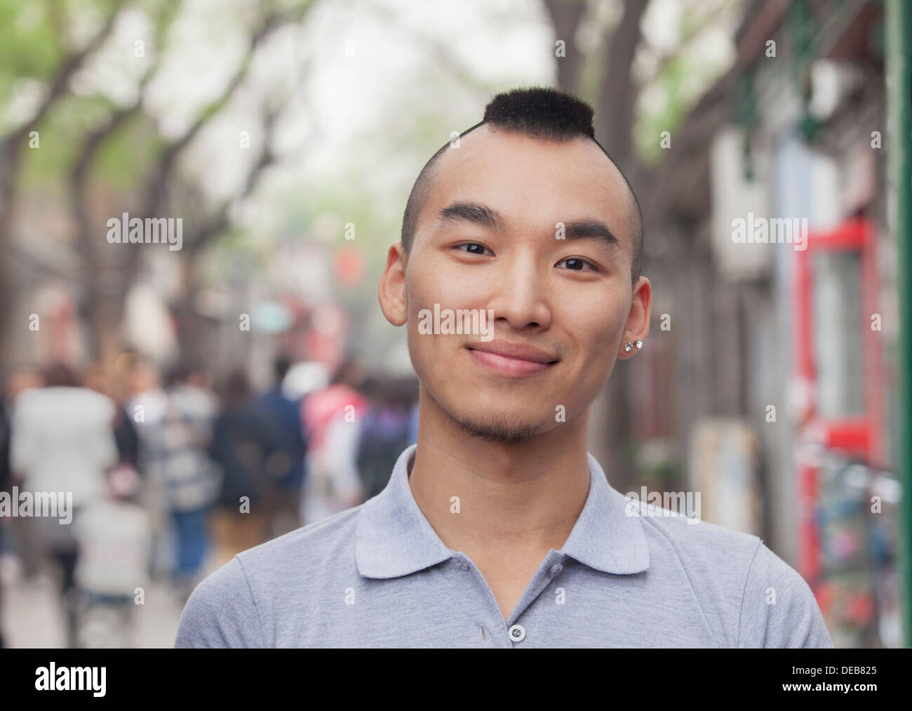 Young Man with Mohawk haircut smiling looking at camera Stock Photo - Alamy Young Man with Mohawk haircut smiling looking at camera Stock Photo - Alamy