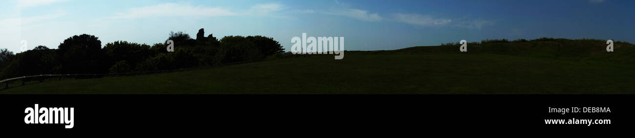hastings castle land bush trees sunset sky clouds Stock Photo