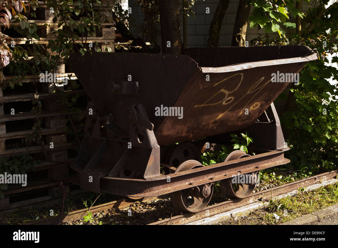 An old rusting mine cart and track Stock Photo
