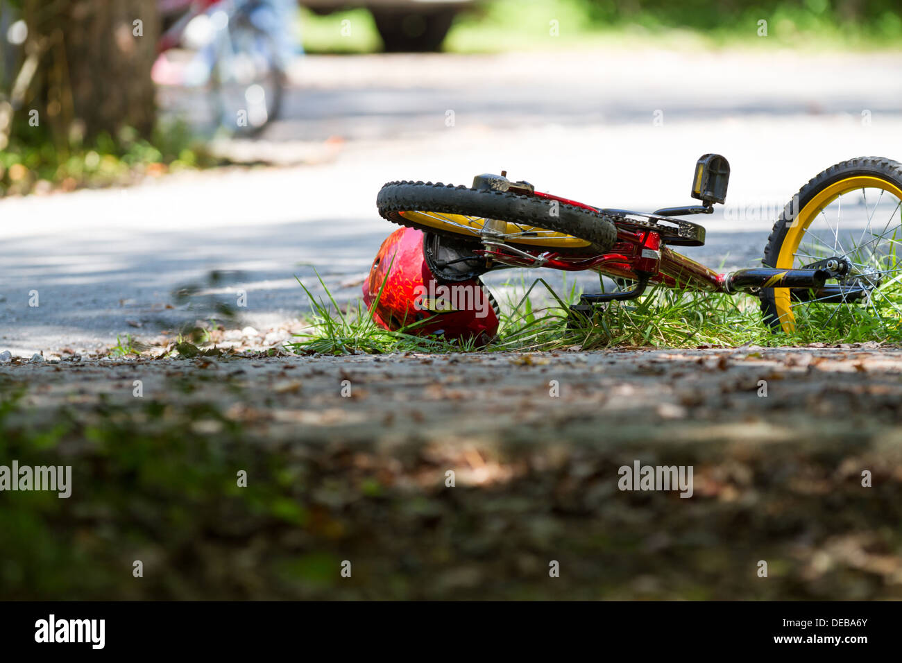 BMX bicycle lying abandoned in the road Stock Photo