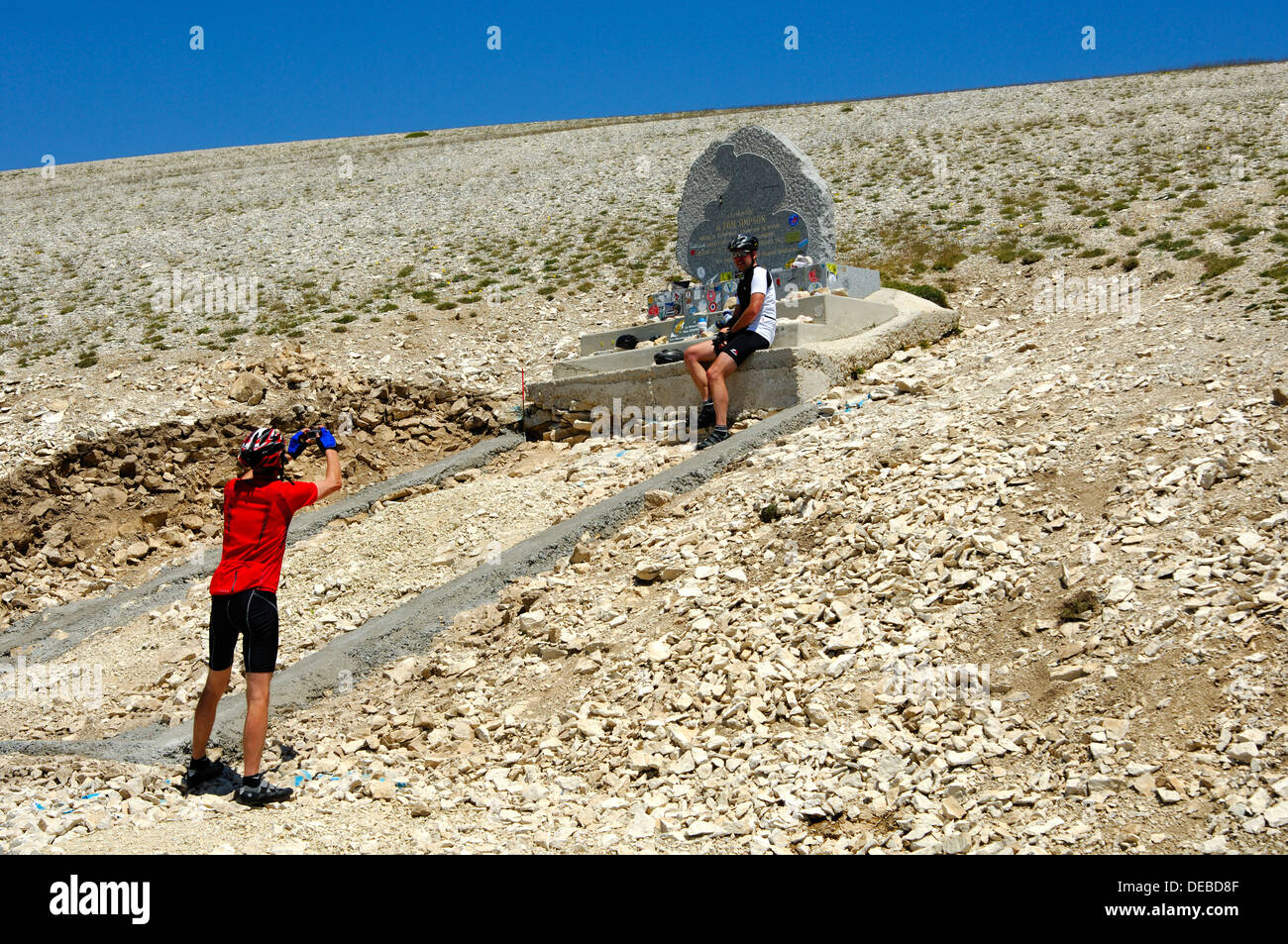 Souvenir photo at the memorial to Tom Simpson on Mont Ventoux, Provence, France Stock Photo
