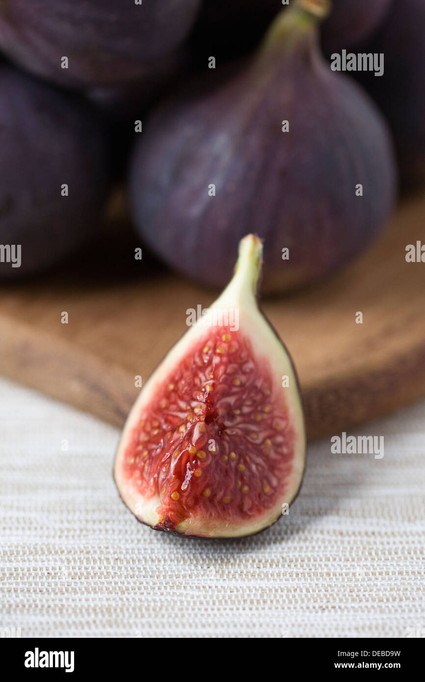 Ficus carica. Bursa figs on a wooden board. Stock Photo