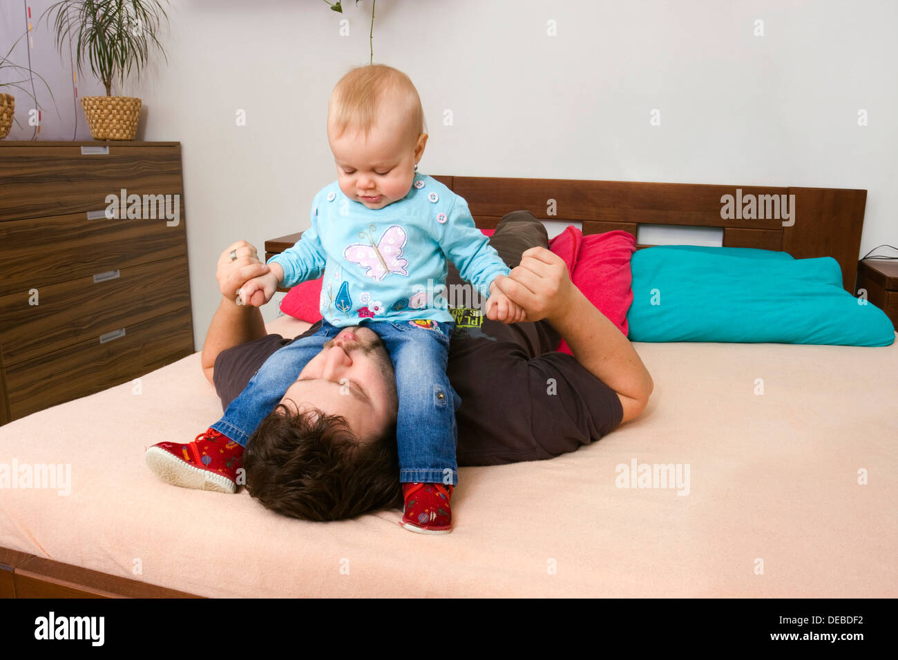 Father, 32 years, playing with baby, 1 year Stock Photo