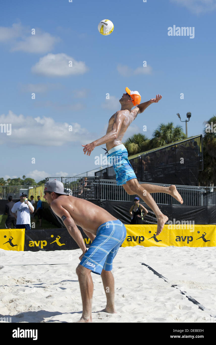 Sept. 13, 2013 - St. Petersburg, Florida, USA - St. Petersburg, FL: PHIL  DALHAUSSER leaps high with an opening game jump serve against Nils Nielsen  and Dave McKienzie in the 2013 AVP