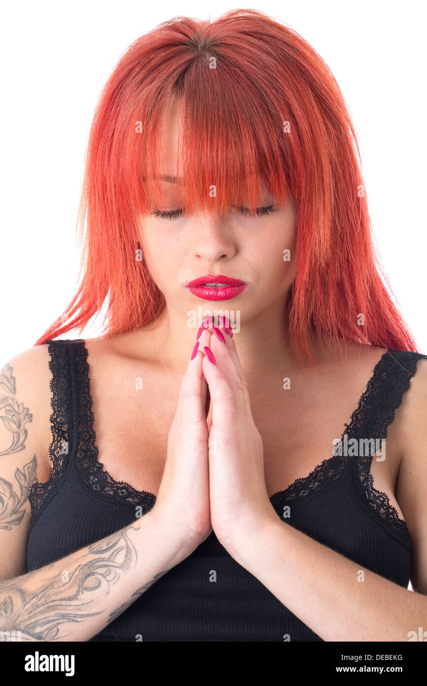 Model Released. Attractive Young Woman Praying Stock Photo