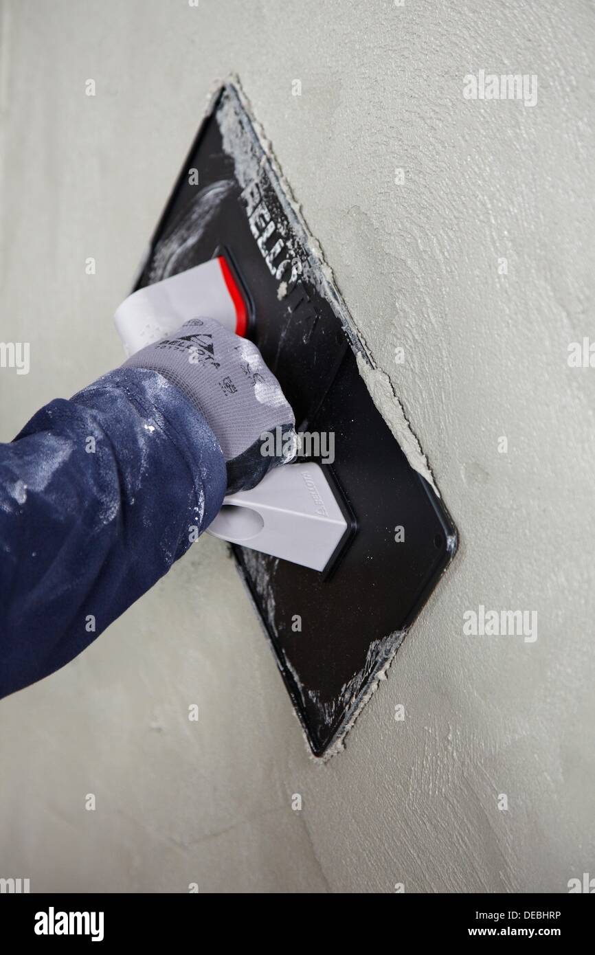 Roughcast, plastering trowel, new homes under construction
